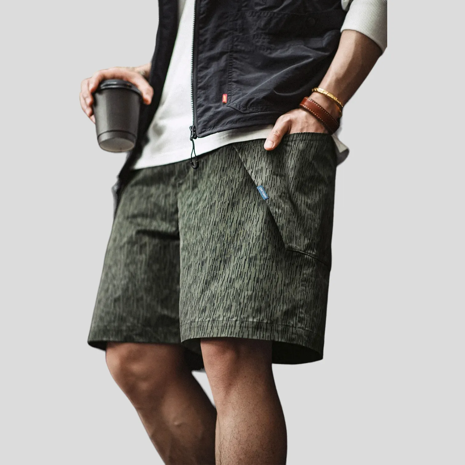 Printed technical fabric shorts with folded pocket bags