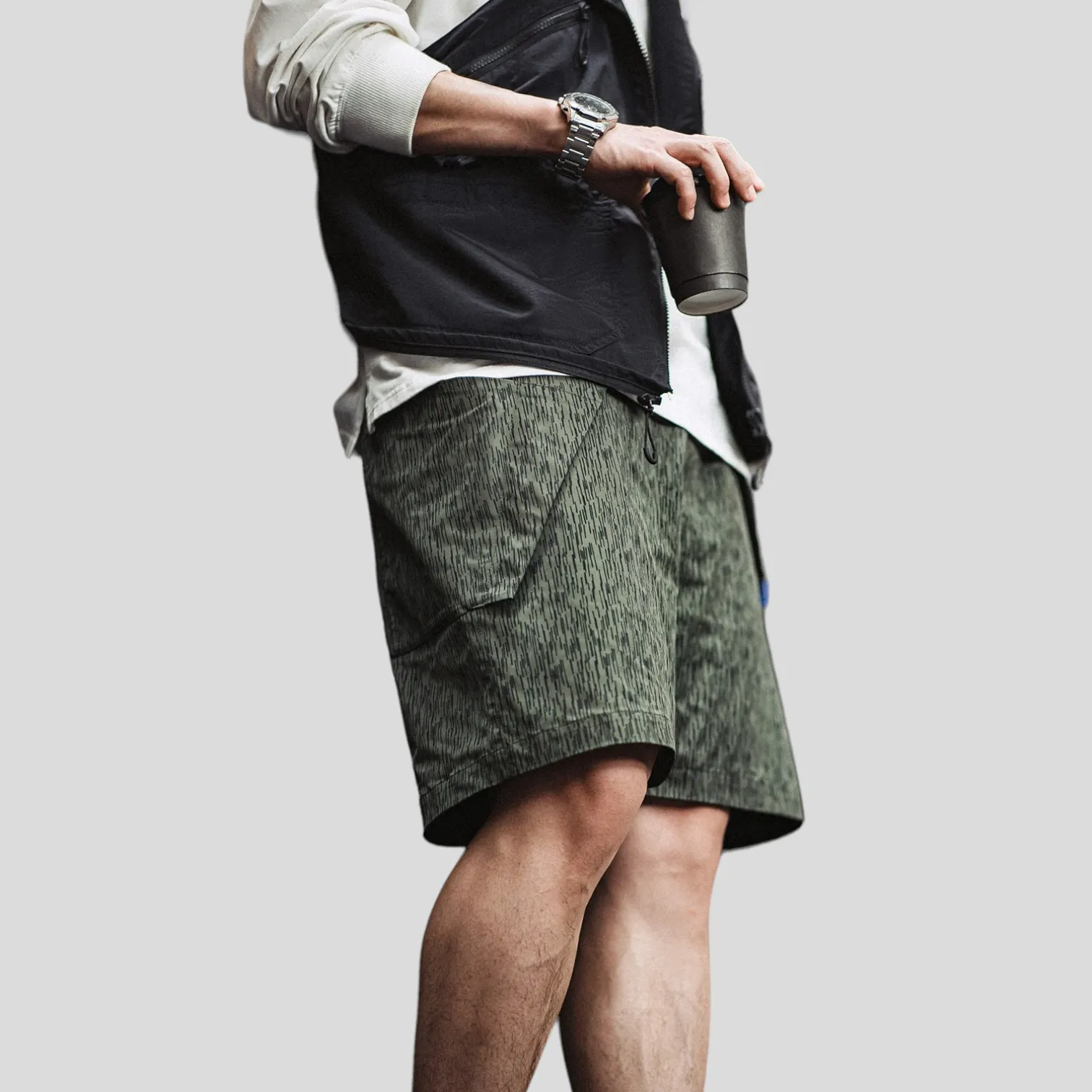 Printed technical fabric shorts with folded pocket bags