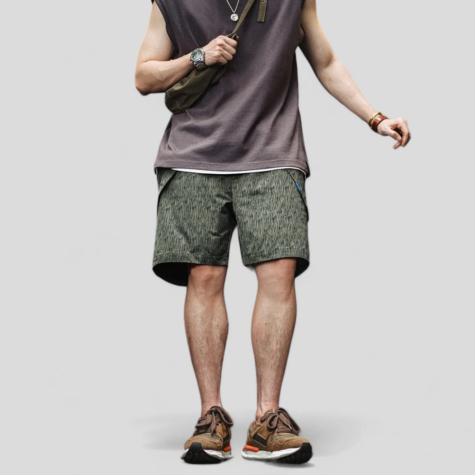 Printed technical fabric shorts with folded pocket bags