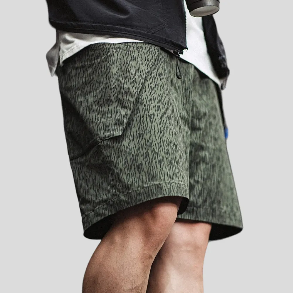 Printed technical fabric shorts with folded pocket bags