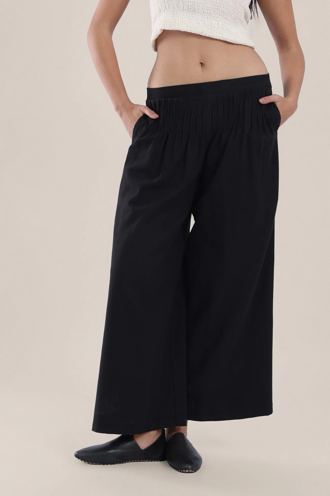 Wide legged pants with tiny front pleats